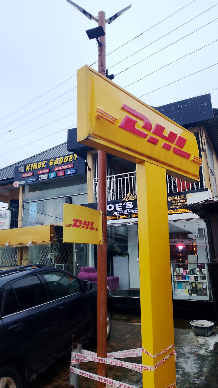 DHL pole signage at the Irhirhi Road service point in Benin City