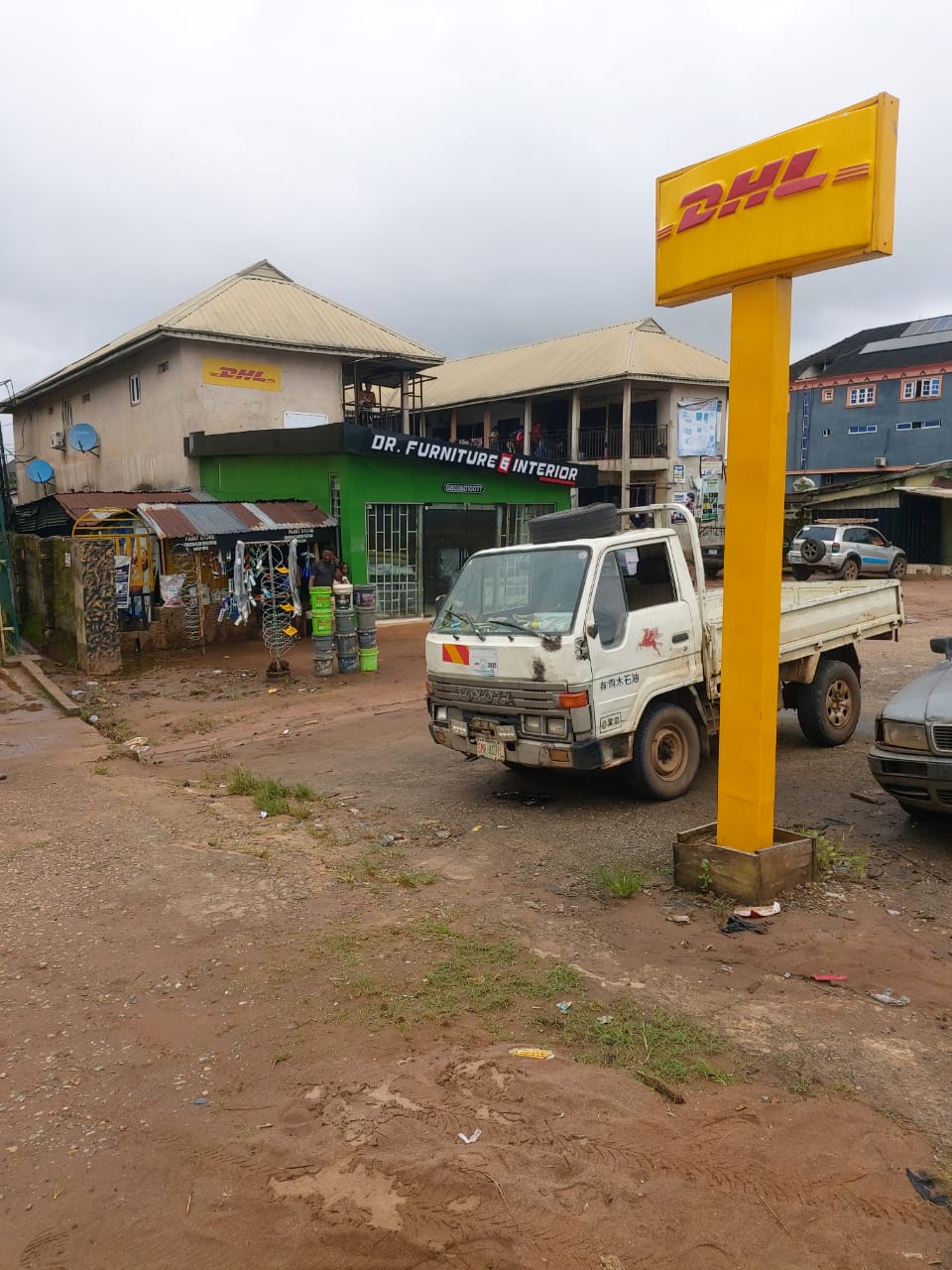 DHL branded pole sign at the Siluko Road area service point, Benin City